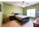 Cozy bedroom with carpet, ceiling fan, and a large window for natural light at 17137 Red Feather Dr, Charlotte, NC 28277