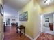 Inviting hallway featuring wood floors, decor, and doorways to other rooms at 17137 Red Feather Dr, Charlotte, NC 28277