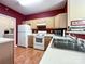 Well-lit kitchen area showcases stainless steel appliances and light wood cabinets at 17137 Red Feather Dr, Charlotte, NC 28277