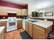Bright kitchen featuring light wooden cabinets and an open layout leading to the living area at 17137 Red Feather Dr, Charlotte, NC 28277