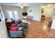 Living room with hardwood floors, a ceiling fan, and furniture at 17137 Red Feather Dr, Charlotte, NC 28277