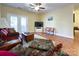 Living room with hardwood floors, a ceiling fan, and patio doors at 17137 Red Feather Dr, Charlotte, NC 28277