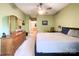 Bright bedroom with a ceiling fan and an ensuite bathroom and walk-in closet at 17137 Red Feather Dr, Charlotte, NC 28277