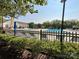 Community pool with lounge chairs and a clubhouse in the background at 17137 Red Feather Dr, Charlotte, NC 28277