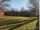 Spacious backyard featuring a well-maintained lawn and a classic brick home exterior at 1807 Brantley Rd, Kannapolis, NC 28083