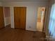 Bedroom with hardwood floors, a closet, and a doorway to a pink bathroom at 1807 Brantley Rd, Kannapolis, NC 28083