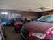 Spacious garage with a car and lawnmower, offering ample storage and parking at 1807 Brantley Rd, Kannapolis, NC 28083