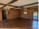 Open living area with beamed ceilings, hardwood floors, and natural light at 1807 Brantley Rd, Kannapolis, NC 28083