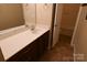 Bathroom with tile flooring, vanity with sink, mirror, and doorway to the toilet at 2043 Covered Bridge Ct, Rock Hill, SC 29732