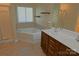 Well-lit bathroom with a shower, jacuzzi tub, and double sink vanity offers functionality and relaxation at 2043 Covered Bridge Ct, Rock Hill, SC 29732