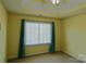 Bedroom with neutral carpet, large window, and pale yellow walls at 2043 Covered Bridge Ct, Rock Hill, SC 29732