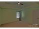 Spacious bedroom features tray ceiling, ceiling fan, window, and neutral carpet at 2043 Covered Bridge Ct, Rock Hill, SC 29732