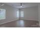 Bedroom featuring multiple windows for ample natural light and hardwood flooring at 2043 Covered Bridge Ct, Rock Hill, SC 29732