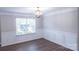 Formal dining room features hardwood floors, wainscotting and stylish light fixture at 2043 Covered Bridge Ct, Rock Hill, SC 29732