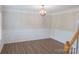 Formal dining room features hardwood floors, wainscotting and stylish light fixture at 2043 Covered Bridge Ct, Rock Hill, SC 29732