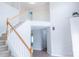 Bright foyer with high ceilings, staircase with wood and white trim, and hardwood floors at 2043 Covered Bridge Ct, Rock Hill, SC 29732
