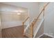 Bright entryway features classic staircase and a view into the formal dining room at 2043 Covered Bridge Ct, Rock Hill, SC 29732