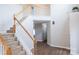 Spacious entryway features staircase with wood and white trim, and hardwood floors at 2043 Covered Bridge Ct, Rock Hill, SC 29732