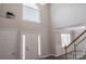 Bright foyer with hardwood floors and natural light from large arched window above the front door at 2043 Covered Bridge Ct, Rock Hill, SC 29732