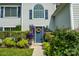 Charming front door with a wreath, surrounded by lush greenery and flowers at 2043 Covered Bridge Ct, Rock Hill, SC 29732
