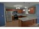 Kitchen with stainless steel appliances, granite countertops, a center island, and wood cabinets at 2043 Covered Bridge Ct, Rock Hill, SC 29732