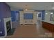 Open concept living room with a fireplace and a large entertainment center at 2043 Covered Bridge Ct, Rock Hill, SC 29732
