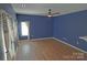 Living room features wood flooring, ceiling fan, and neutral paint at 2043 Covered Bridge Ct, Rock Hill, SC 29732