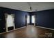 Spacious living room with hardwood flooring, ceiling fan, and neutral paint at 2043 Covered Bridge Ct, Rock Hill, SC 29732