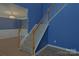 Carpeted stairs feature wood banister and leads to upper level at 2043 Covered Bridge Ct, Rock Hill, SC 29732