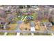 An aerial view of a single-Gathering home with a well-manicured lawn in a suburban neighborhood at 4065 Lost Creek Ct, Hickory, NC 28602