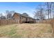 Large backyard with a deck, patio, and a privacy fence at 4065 Lost Creek Ct, Hickory, NC 28602