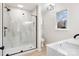 Modern bathroom featuring a glass-enclosed shower with light tile, and dark fixtures at 4065 Lost Creek Ct, Hickory, NC 28602