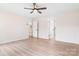 Large unfurnished bedroom features light walls, wood-style flooring, and two doorways at 4065 Lost Creek Ct, Hickory, NC 28602
