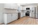 Modern white kitchen featuring stainless steel appliances and sleek countertops at 4065 Lost Creek Ct, Hickory, NC 28602