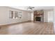 Spacious living room with wood-look flooring, a stone fireplace, and bright natural light at 4065 Lost Creek Ct, Hickory, NC 28602