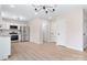Open-concept living area with modern lighting, light colored walls, and doors to other rooms at 4065 Lost Creek Ct, Hickory, NC 28602