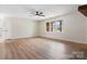 Bright and airy living room featuring wood-look floors and a large window at 4065 Lost Creek Ct, Hickory, NC 28602