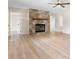 Bright living room featuring a stone fireplace, neutral furniture, and stylish decor at 4065 Lost Creek Ct, Hickory, NC 28602