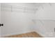Walk-in closet with wood floor and multiple metal shelves for optimal organization at 4065 Lost Creek Ct, Hickory, NC 28602