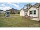 Large backyard with a playground, patio, and well-maintained lawn, ideal for outdoor activities and relaxation at 4131 Nottaway Place Dr, Matthews, NC 28105