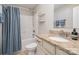 Bright bathroom featuring granite counters, neutral cabinets, and a shower and tub combo with tiled walls at 4131 Nottaway Place Dr, Matthews, NC 28105