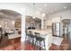 Spacious kitchen island with bar seating and granite countertops, perfect for entertaining guests at 4131 Nottaway Place Dr, Matthews, NC 28105