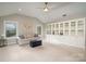 Spacious living room featuring built-in bookshelves and comfortable seating area at 4131 Nottaway Place Dr, Matthews, NC 28105