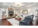 Elegant living room featuring a stone fireplace, coffered ceilings, and stylish decor for comfortable living at 4131 Nottaway Place Dr, Matthews, NC 28105