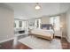 Spacious main bedroom featuring a sitting area and a large window for natural light at 4131 Nottaway Place Dr, Matthews, NC 28105