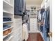 Walk-in closet with custom shelving and ample storage space for clothing and shoes at 4131 Nottaway Place Dr, Matthews, NC 28105