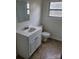 Clean bathroom featuring a white vanity, toilet, and neutrally patterned floor at 4161 Slanting Bridge Rd, Sherrills Ford, NC 28673
