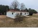 This single-story home features a red roof, white siding, and minimal landscaping at 4161 Slanting Bridge Rd, Sherrills Ford, NC 28673