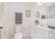 Clean bathroom featuring modern fixtures, a toilet, a vanity, and decorative artwork enhancing the space at 4930 Crestmont Dr, Charlotte, NC 28205