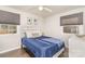A bedroom with natural light, complemented by a well-placed bed and a classic dresser at 4930 Crestmont Dr, Charlotte, NC 28205